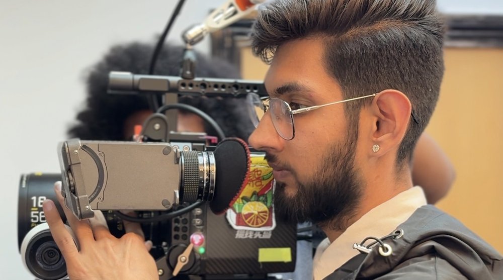 Abhinav Khatri operating a cinema camera on set