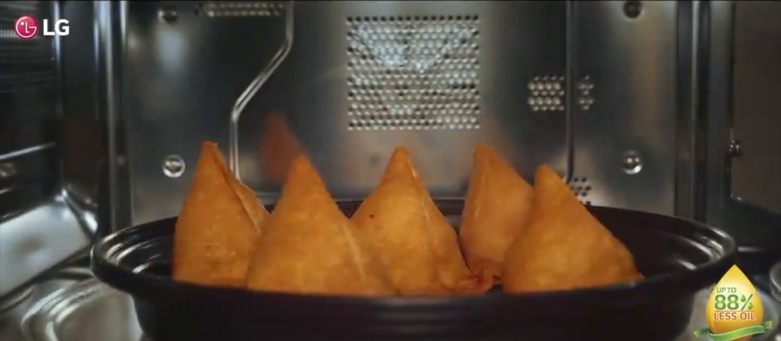 Samosas crisping inside an LG microwave